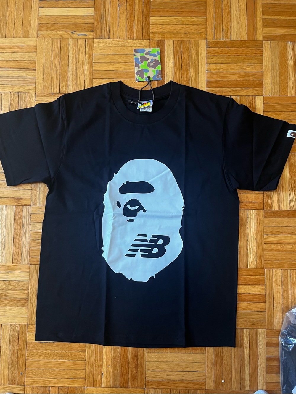 New Balance Black Tee with Large Light Gray Ape Graphic